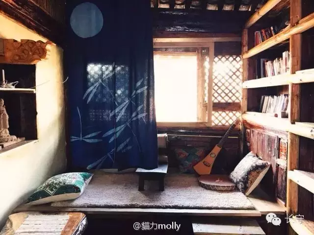 The loft and book wall inside the early Changshou Tea House