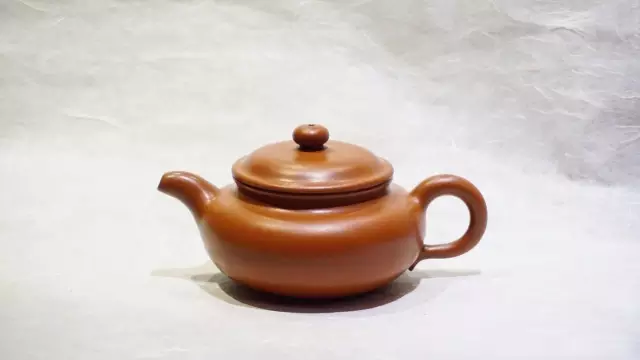 A narrow celadon magnolia cup