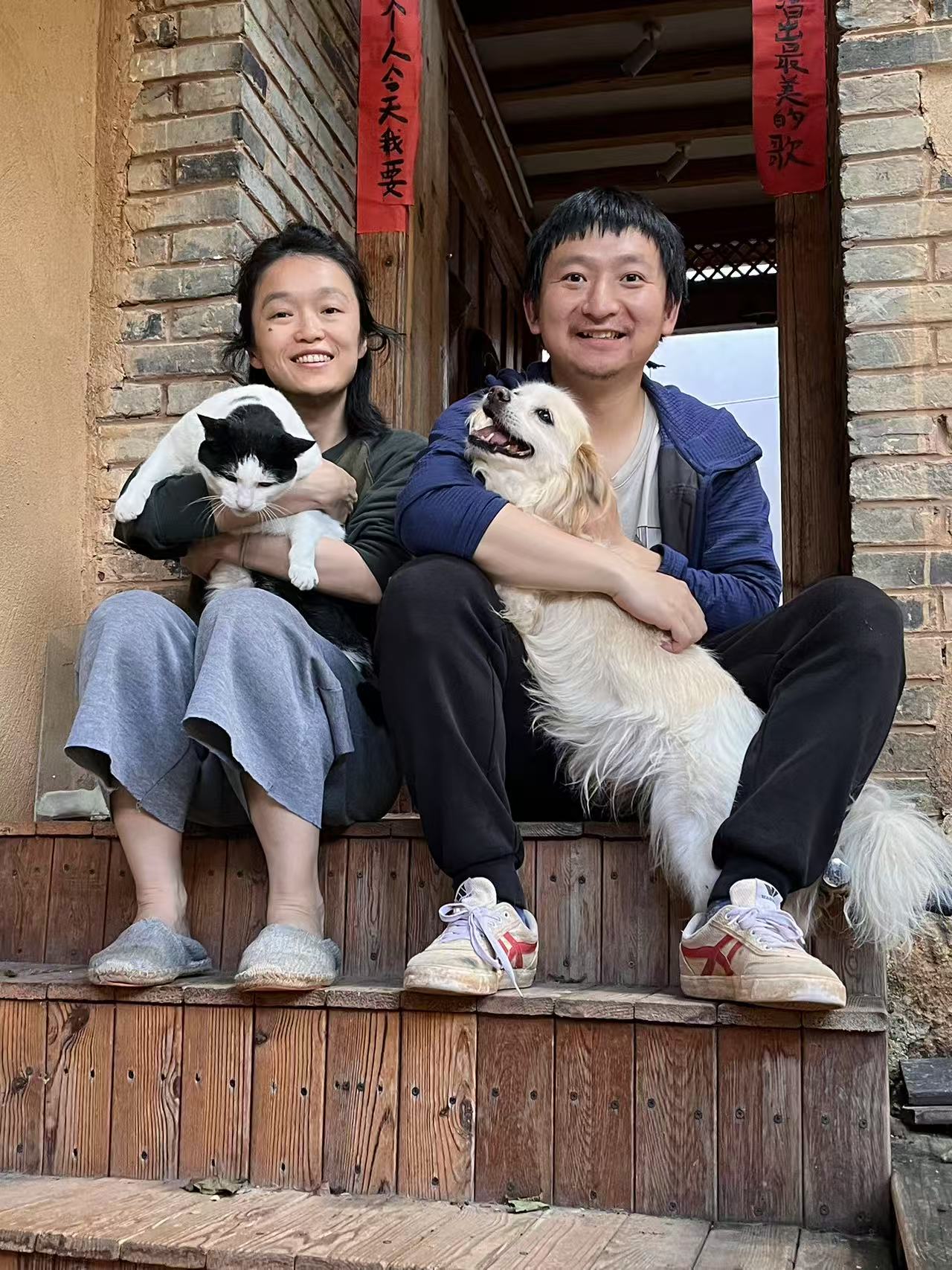 Gu Rui and Luo Bo at home with their animals in Shaxi