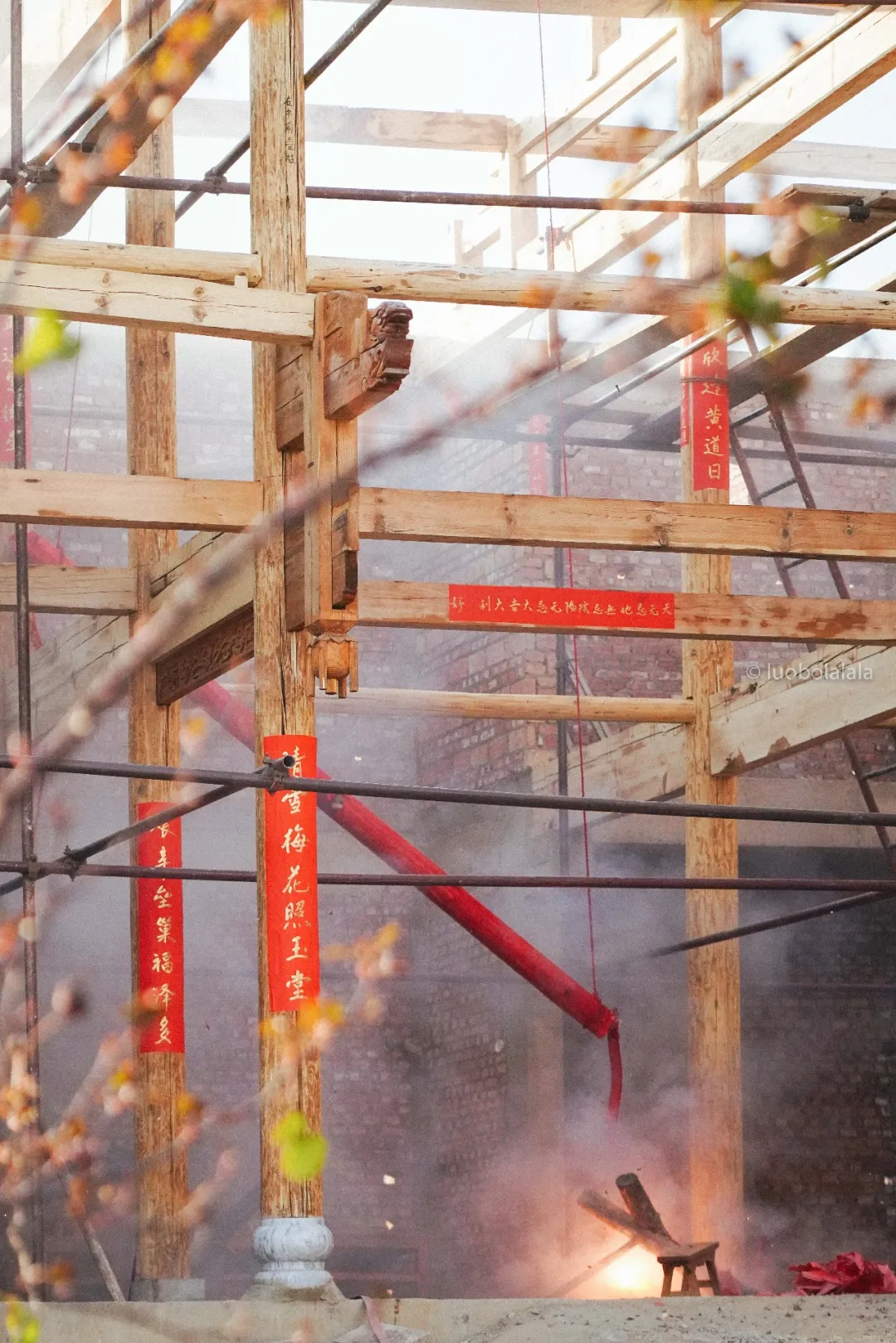 Red blessing papers on the new timber columns